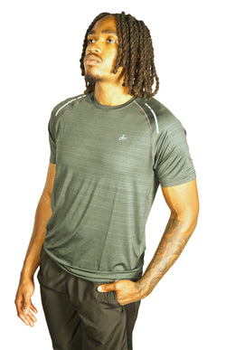 Man wearing a green athletic shirt with Kamili logo