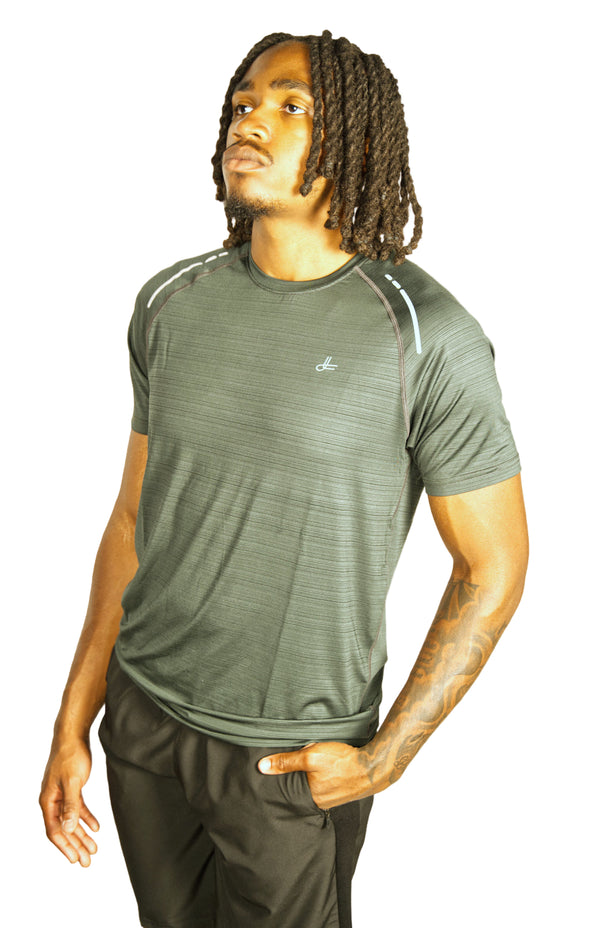 Man wearing a green athletic shirt with Kamili logo