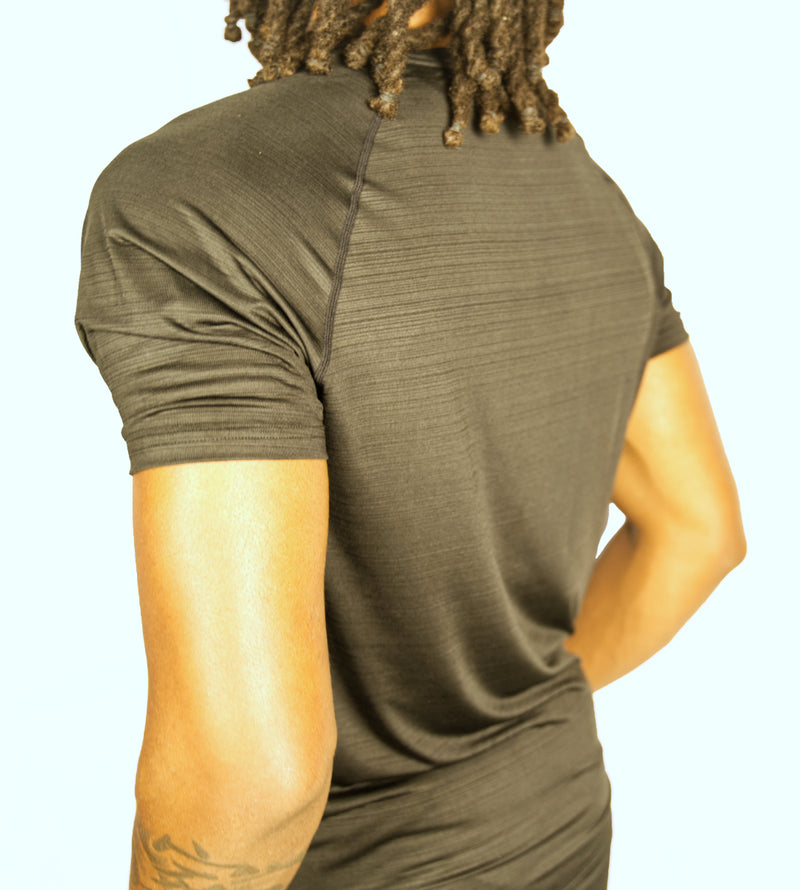 Man wearing a black athletic shirt with a Kamili logo